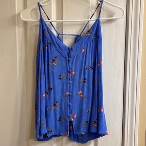 Blue shirt with buttons and flowers